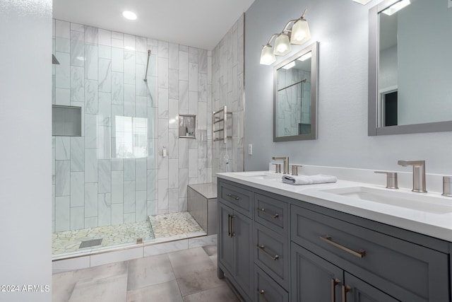 bathroom featuring vanity, walk in shower, and tile patterned floors