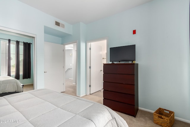 bedroom with light colored carpet