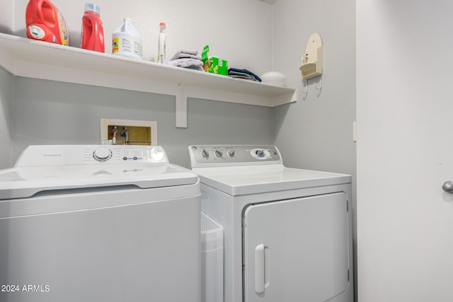 washroom with washing machine and dryer