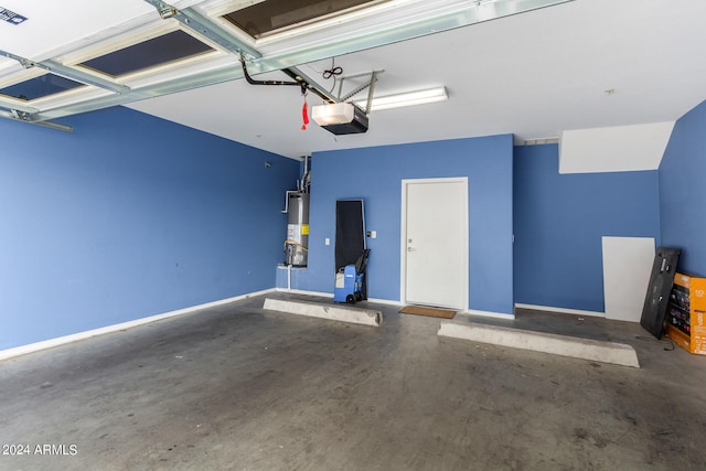 garage with gas water heater and a garage door opener