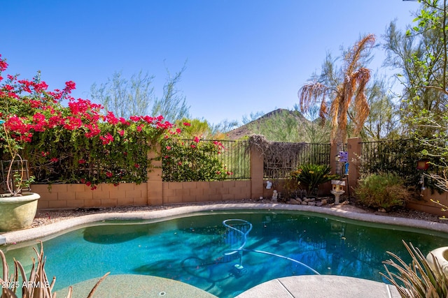 view of pool with a mountain view