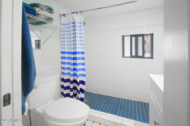 bathroom featuring walk in shower and toilet