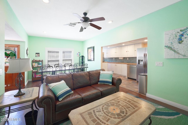 living room featuring ceiling fan