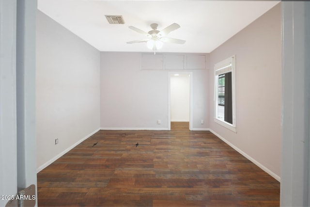 unfurnished room featuring dark hardwood / wood-style flooring and ceiling fan