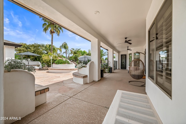 view of patio featuring ceiling fan