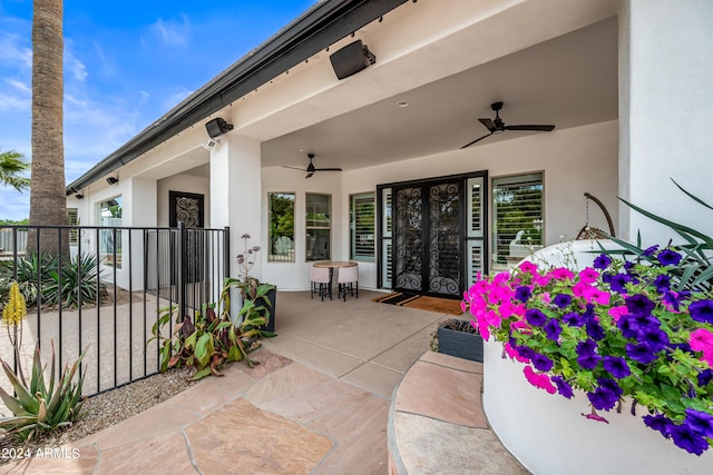 exterior space featuring ceiling fan