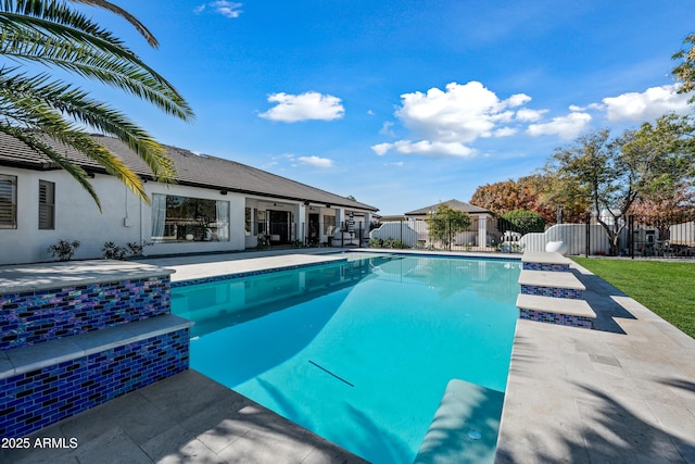 view of swimming pool with a patio