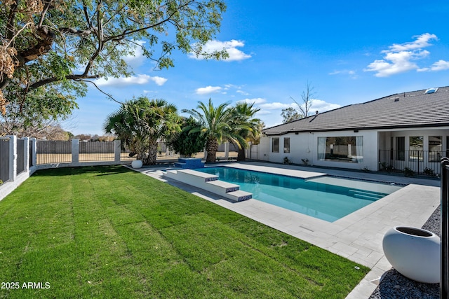 view of pool with a yard and a patio area