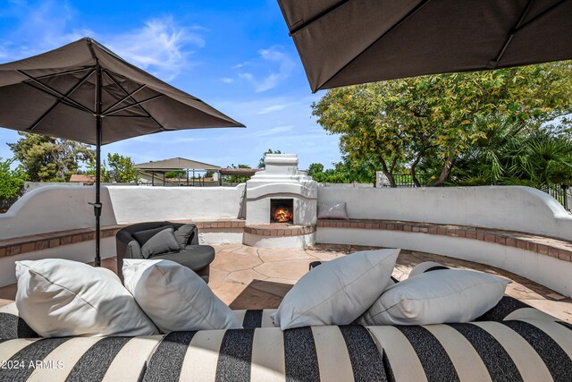 view of patio featuring an outdoor fireplace