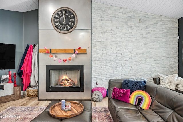 living room with lofted ceiling and hardwood / wood-style flooring