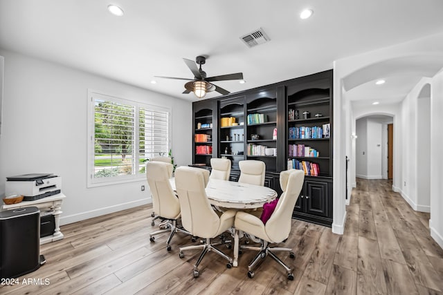 dining room with light hardwood / wood-style flooring and ceiling fan