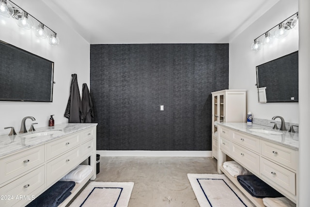 bathroom with vanity and concrete flooring