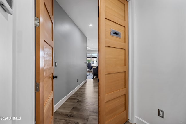 corridor with dark wood-type flooring