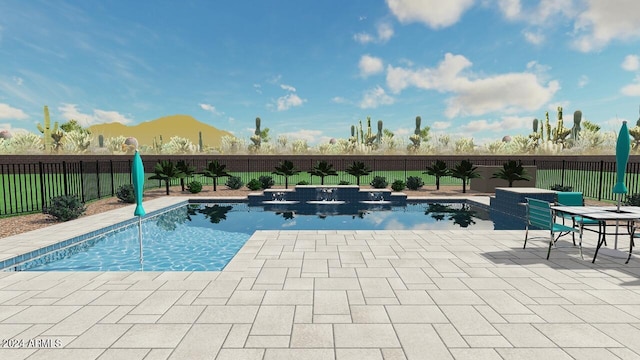 view of swimming pool with a mountain view and a patio area