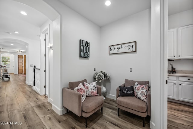 sitting room with light hardwood / wood-style flooring