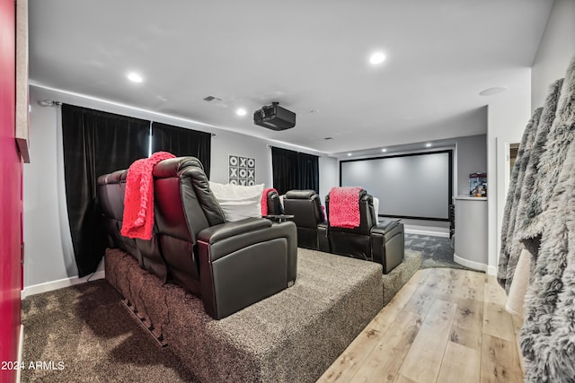 cinema room featuring light wood-type flooring