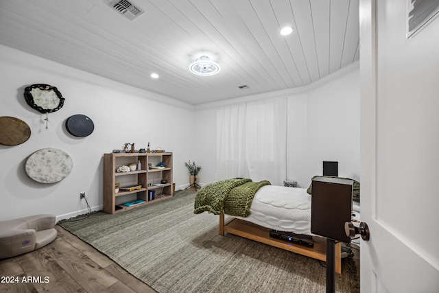 bedroom with hardwood / wood-style floors and wood ceiling