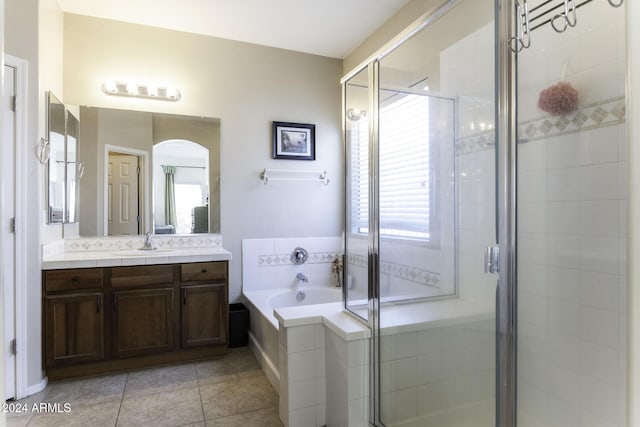 bathroom featuring tile patterned floors, vanity, and separate shower and tub