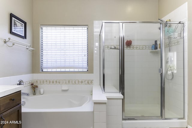 bathroom with vanity and plus walk in shower