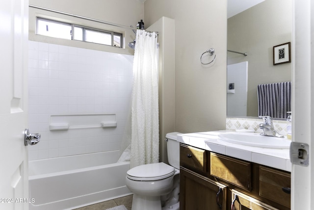 full bathroom with tile patterned flooring, shower / tub combo, vanity, and toilet