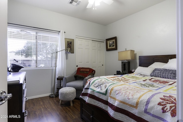 bedroom with ceiling fan, dark hardwood / wood-style flooring, and a closet