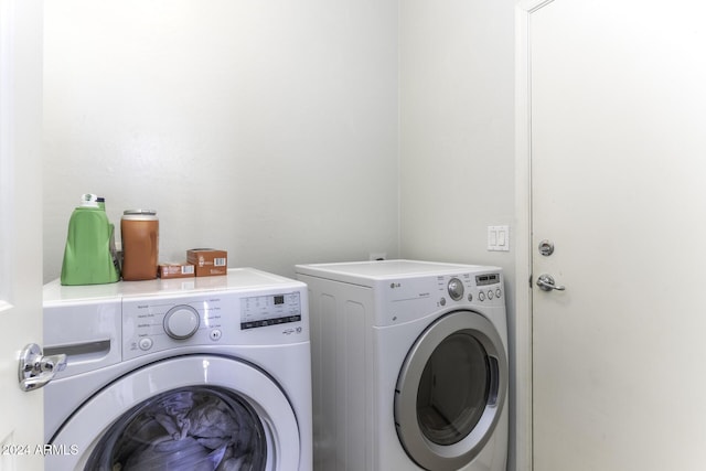 laundry room with washer and dryer