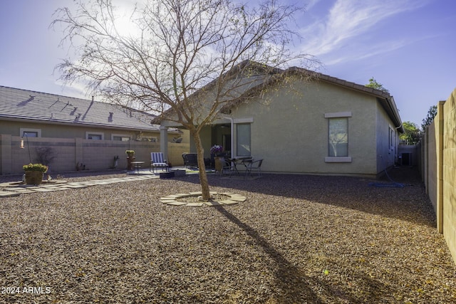 back of house with a patio area