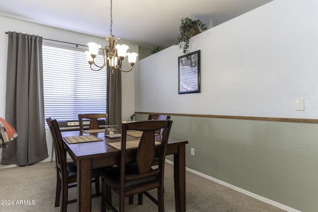 carpeted dining room with a notable chandelier