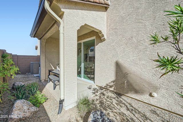 10047 E Ulysses Ave, Mesa, AZ 85212 - view of side of home with stucco siding and a central air condition unit