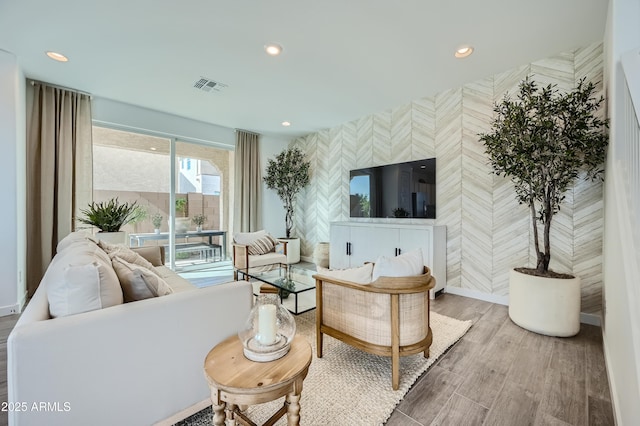 10047 E Ulysses Ave, Mesa, AZ 85212 - living area featuring an accent wall, recessed lighting, wallpapered walls, and wood finished floors