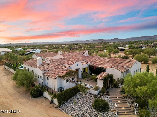 aerial view at dusk with a mountain view