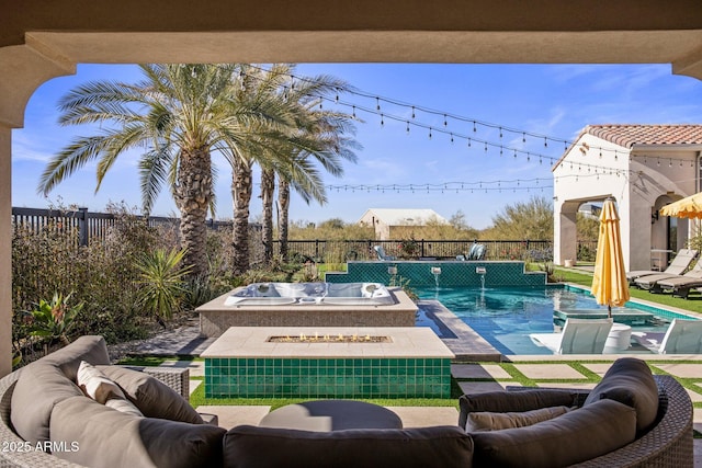 view of swimming pool featuring pool water feature and a hot tub