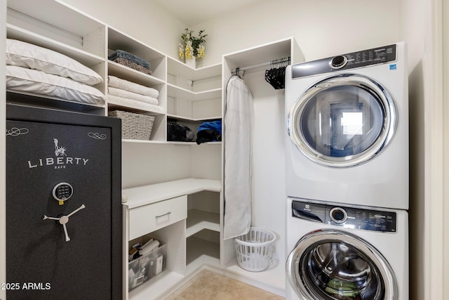 washroom featuring light tile patterned floors and stacked washer and clothes dryer