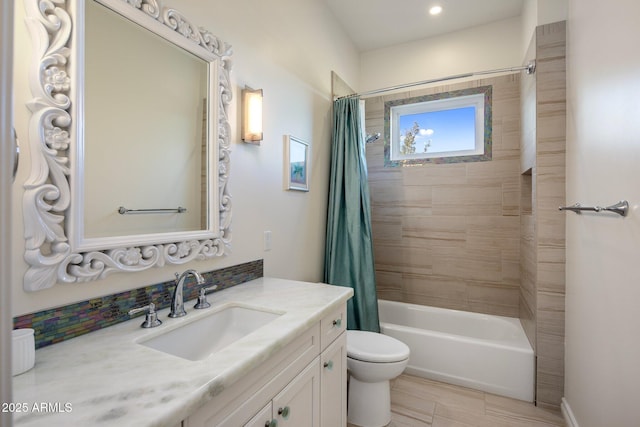 full bathroom featuring shower / bathtub combination with curtain, vanity, and toilet