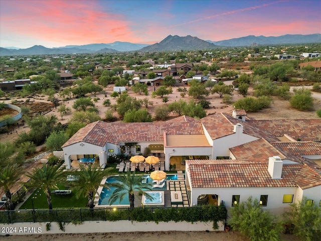 aerial view at dusk with a mountain view