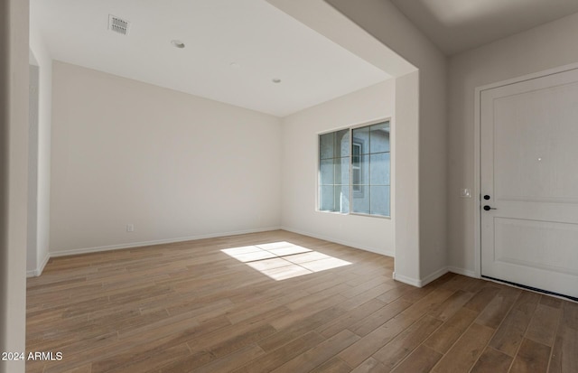 foyer entrance with light hardwood / wood-style floors