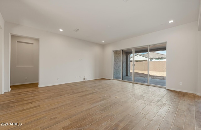 empty room with light hardwood / wood-style floors