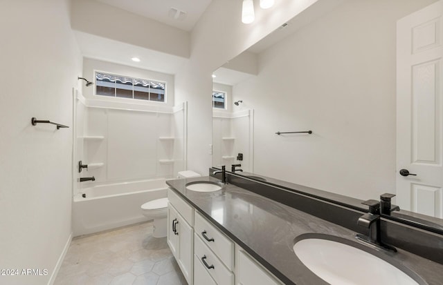 full bathroom featuring tile patterned flooring, vanity,  shower combination, and toilet