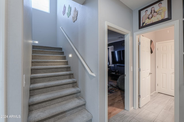 stairway featuring hardwood / wood-style flooring