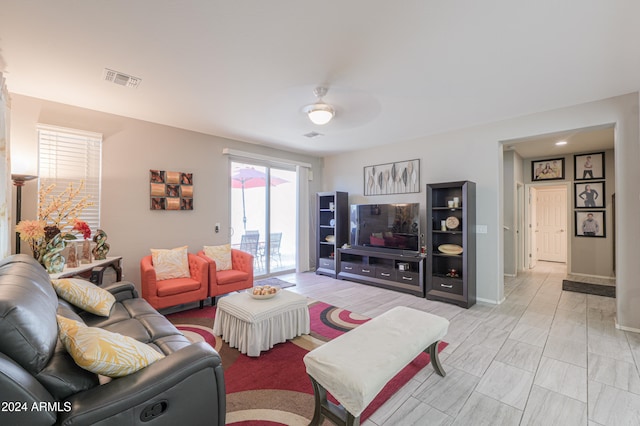 living room featuring ceiling fan