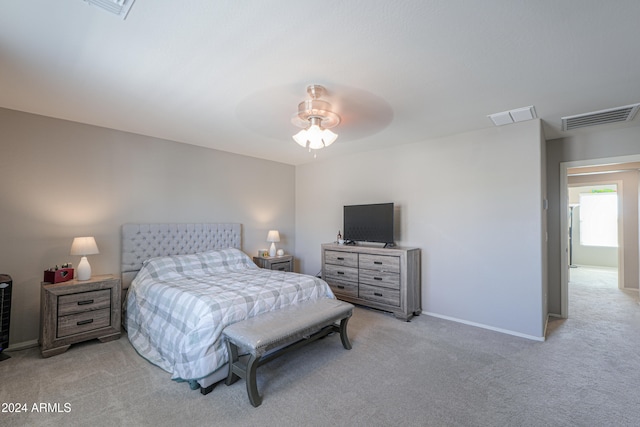 bedroom with ceiling fan and light colored carpet