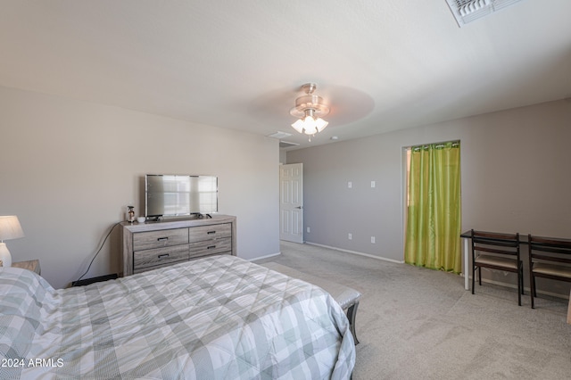 bedroom with ceiling fan and light carpet