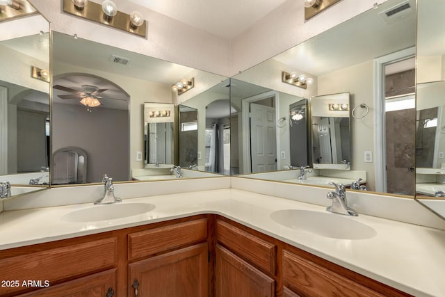 bathroom featuring a sink, visible vents, and double vanity