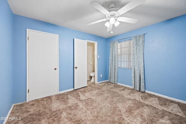 unfurnished bedroom with connected bathroom, light colored carpet, and ceiling fan