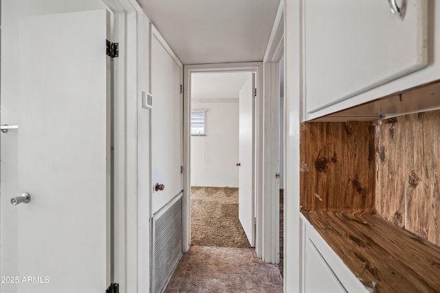 hallway with light carpet