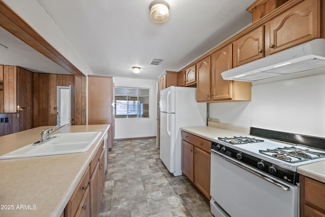 kitchen featuring sink and white appliances