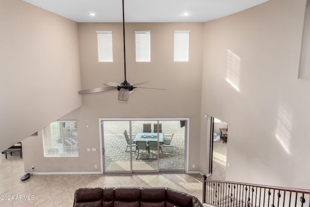 living room with a wealth of natural light and ceiling fan