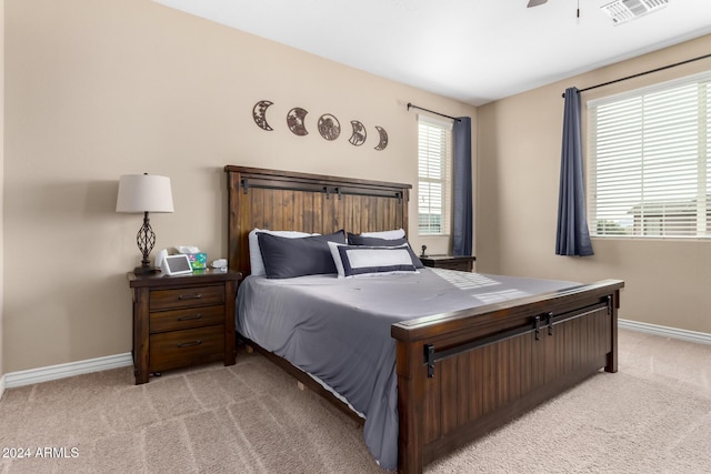 bedroom featuring ceiling fan and light colored carpet