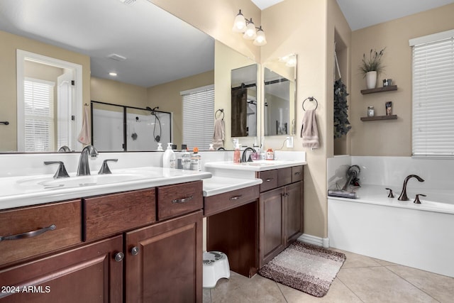 bathroom with vanity, tile patterned flooring, and plus walk in shower