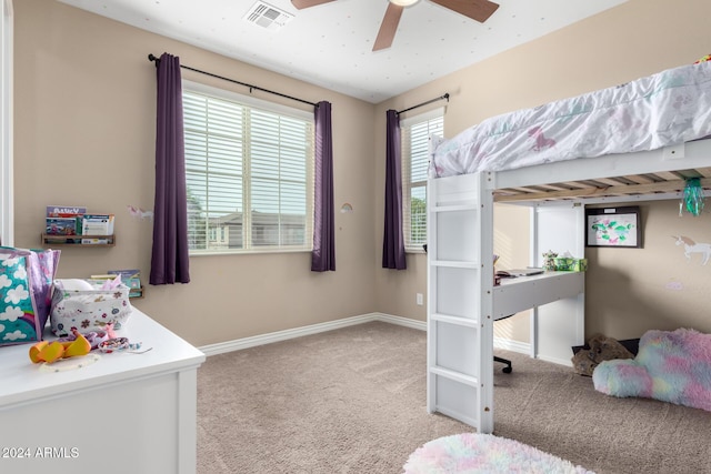 bedroom featuring ceiling fan and light carpet